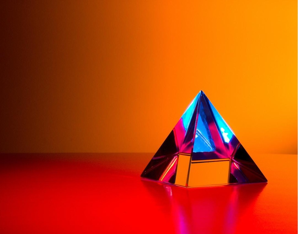 Pyramid Chart - A glass pyramid in a red room